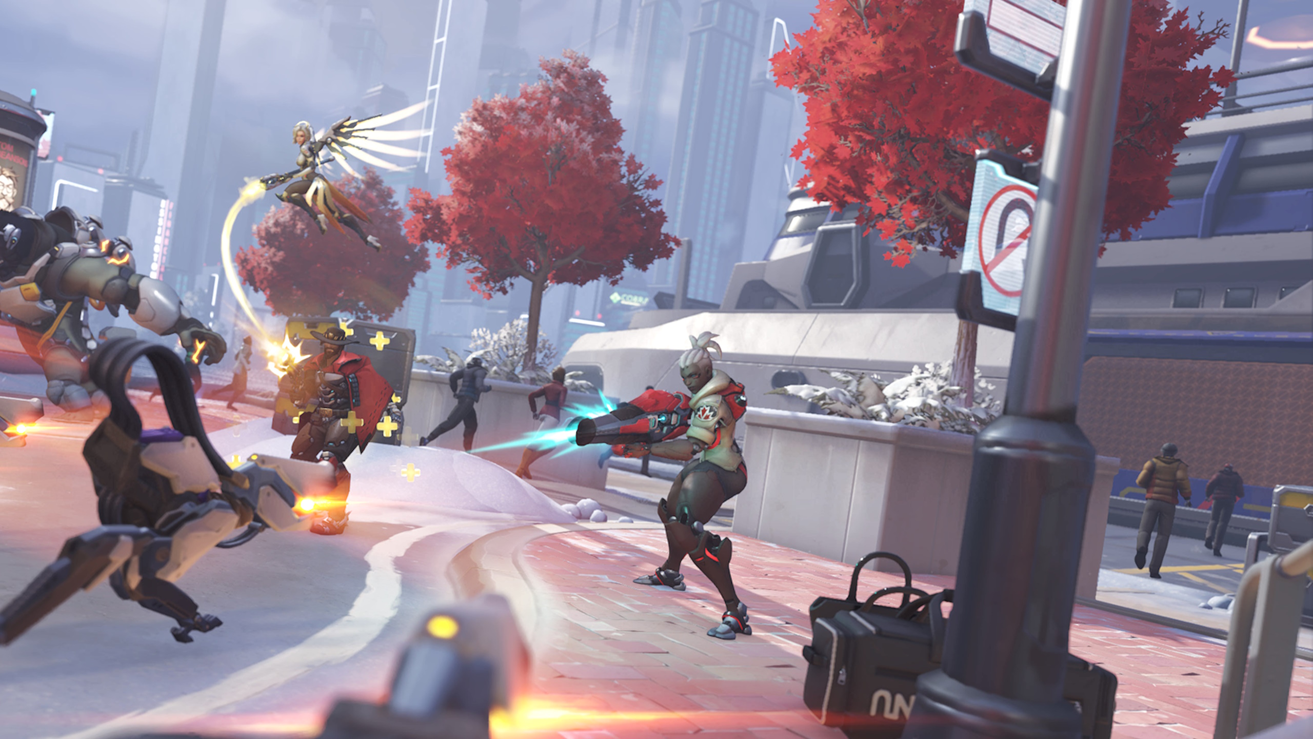 A woman wielding a large red gun is defending a location against a swarm of robots, while a flying blonde woman and a man with a cowboy hat fight alongside her.